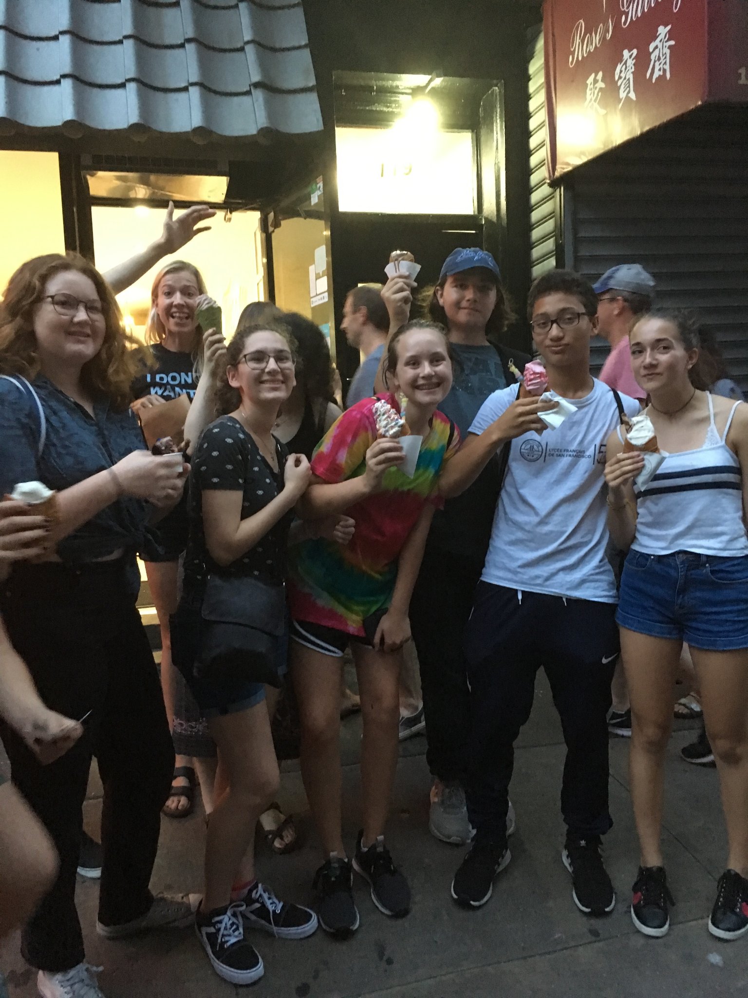 Campers with ice cream in Chinatown at night
