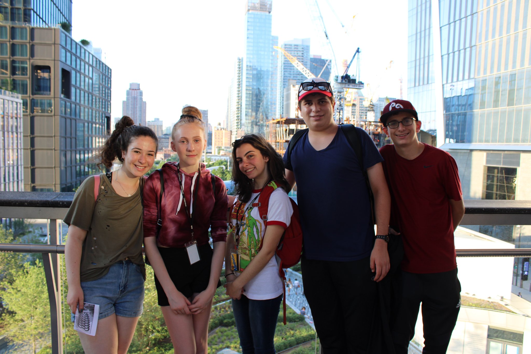 Squad of campers on the Hudson Yards overlook with NYC skyline