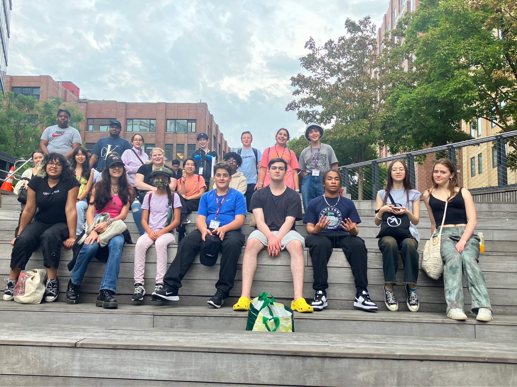 Large group of campers on outdoor amphitheater steps