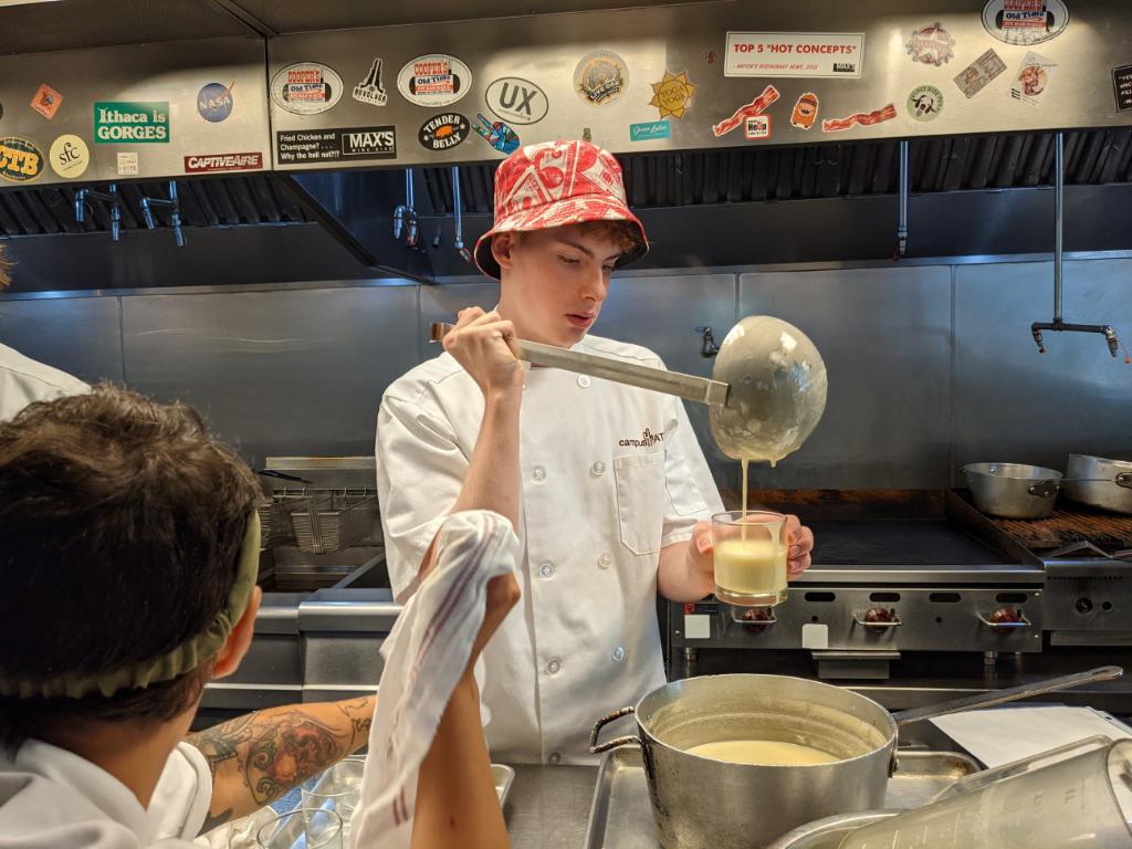 Pouring the gravy at Washington DC Cooking Camp 2023